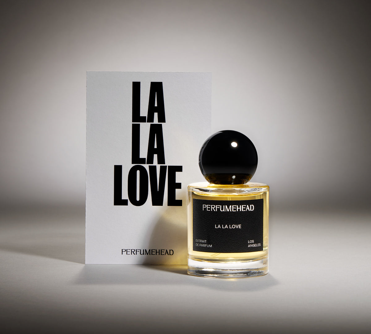 LA LA Love  extrait de parfum 50ml signature spray bottle and typography. 