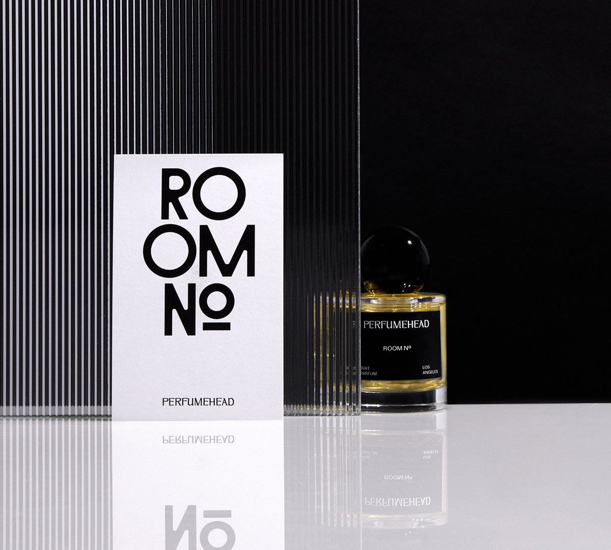 Room No. extrait de parfum 50ml signature spray bottle and typography.