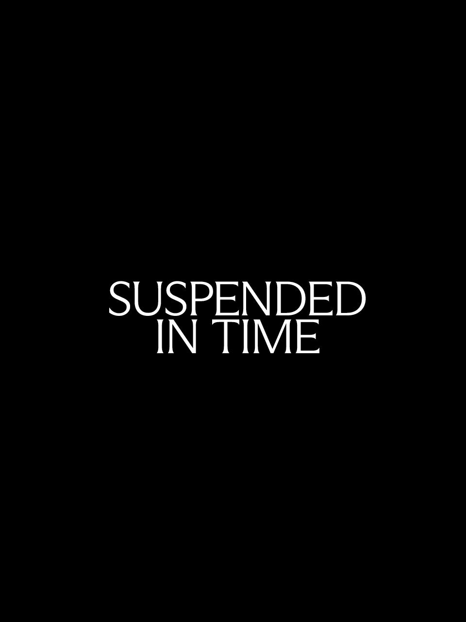 White serif text reading 'SUSPENDED IN TIME' centered on a solid black background.