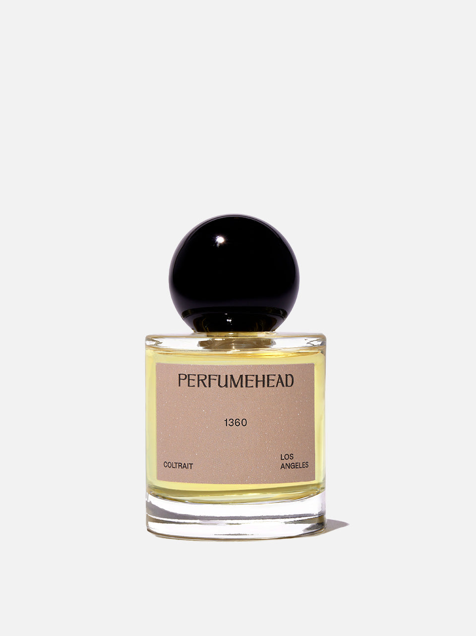 A bottle of Perfumehead 1360 Eau de Parfum with a black spherical cap and a beige label, set against a plain white background.