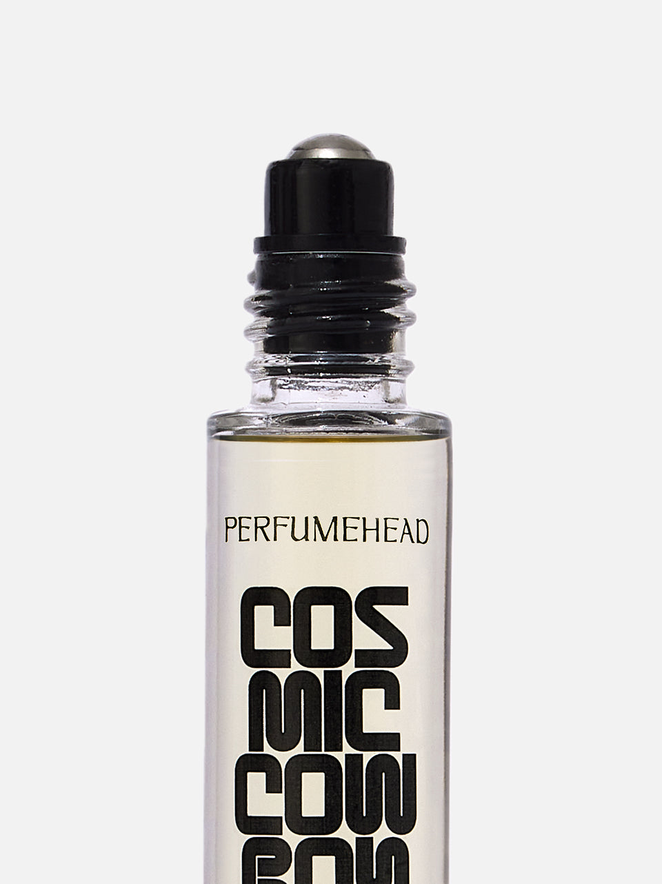 A clear glass rollerball bottle with a black cap, labeled 'PERFUMEHEAD COSMIC COWBOY' in bold black text, on a light gray background.