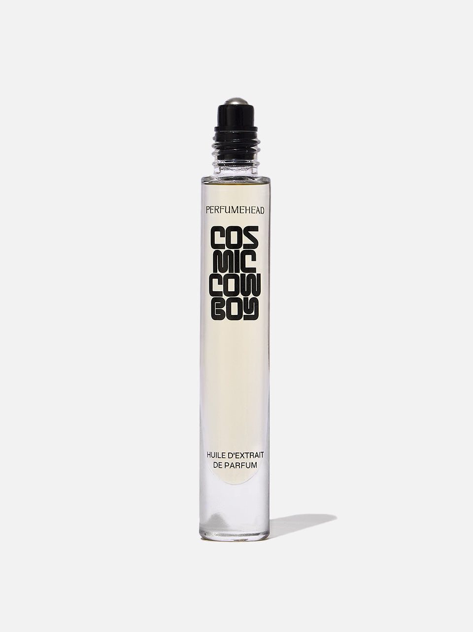 A clear cylindrical rollerball perfume bottle with a black cap, labeled 'COSMIC COWBOY' standing on a white background.