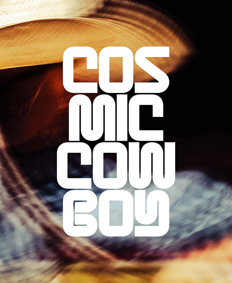 A stylized graphic with large white block text reading 'COSMIC COWBOY' over a blurred cowboy-themed background featuring a hat and western clothing.