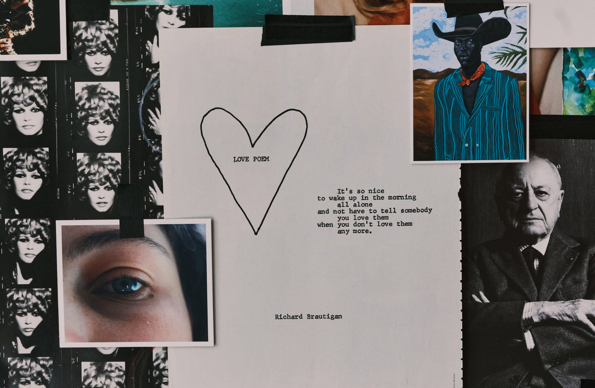 A collage-style flat lay featuring a central white sheet with a hand-drawn heart, a love poem by Richard Brautigan, a close-up eye photo, black-and-white portrait prints, and a colorful painting of a cowboy.