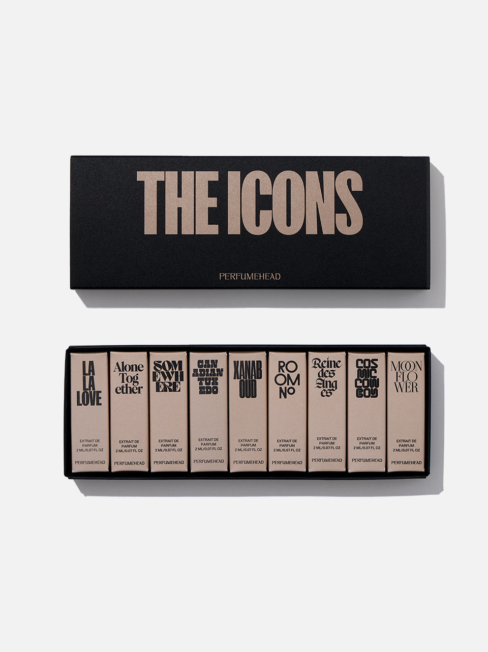 A perfume gift set featuring a black box labeled 'THE ICONS' above an open tray of nine matching beige and black perfume vial boxes with stylized typography, photographed on a white background.