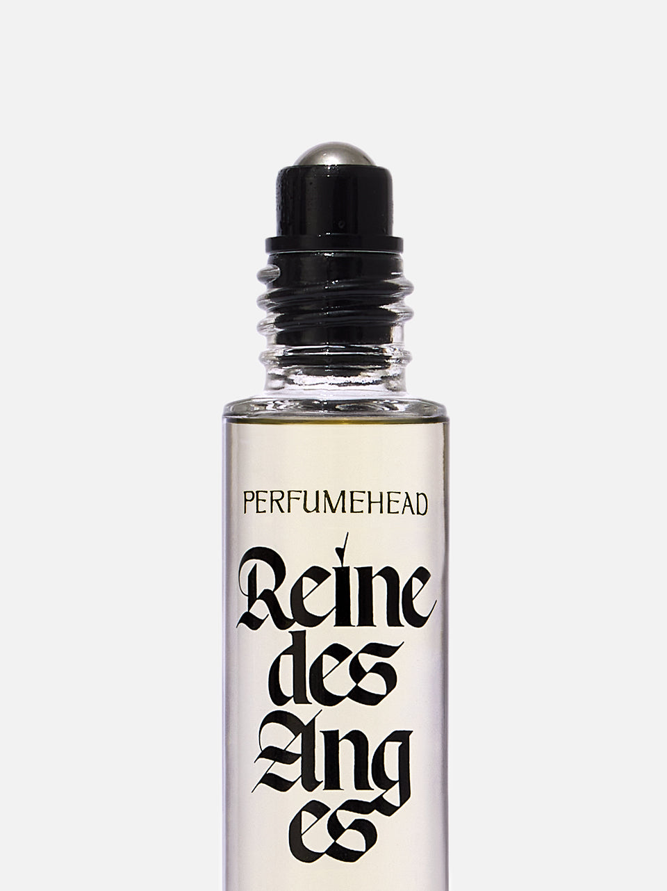 A clear glass perfume rollerball bottle with a black cap and a white label featuring the text 'PERFUMEHEAD' and 'Reine des Anges' in black gothic lettering, set against a light gray background.