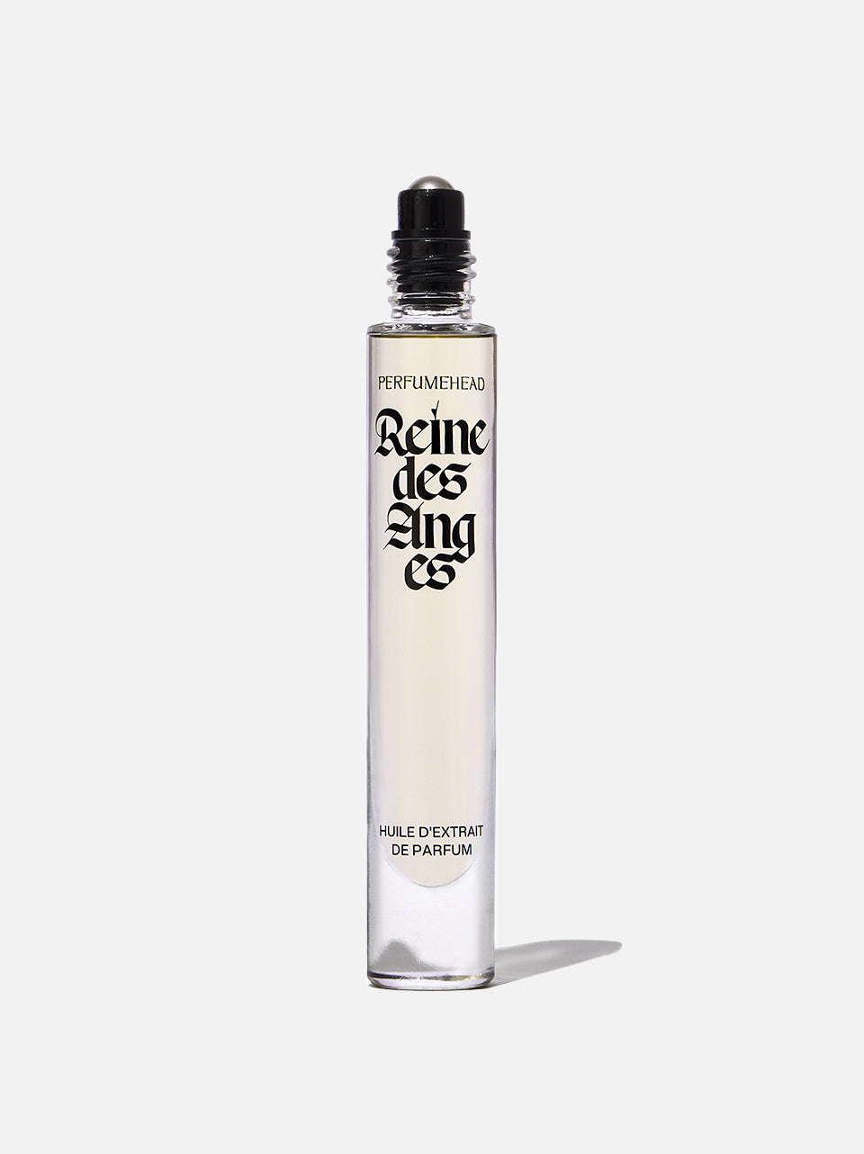 A clear glass rollerball perfume bottle with a black cap, featuring the brand name 'PERFUMEDHEAD' and the product name 'Reine des Anges' in black gothic lettering, set against a light gray background.