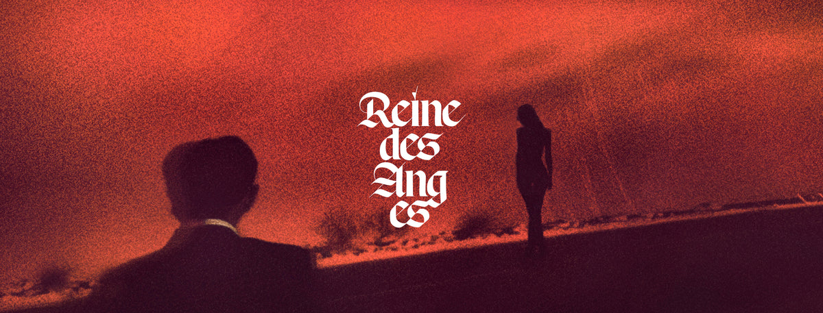 Graphic with the text 'Reine des Anges' in a large, stylized white gothic font. The background is a textured, grainy red-orange sky with a dark silhouette of two people standing.