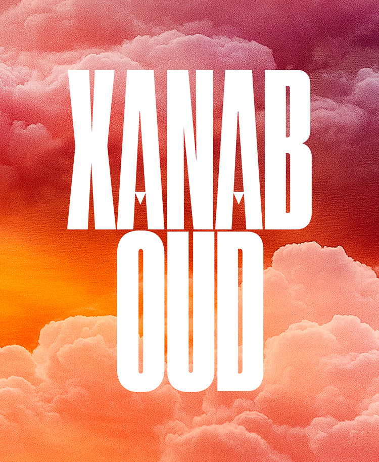 A square graphic with the words 'XANAB OUD' in large white serif letters over a dramatic sky background filled with pink, orange, and red clouds.